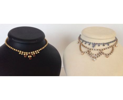 3 vintage evening necklaces, one set with aurora borealis stones, one set with blue and red striped stones, and the other wit