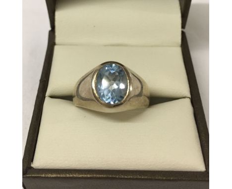 Heavy 925 ring with oval blue topaz stone. Size R.