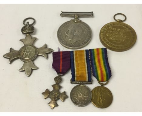 A WW1 medal trio comprising a George V MBE (military ribbon) hallmarked London 1918, 1914-18 war medal and 1914-18 victory me