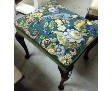 A vintage stool with parrots & flower upholstery.