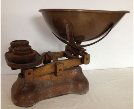 A large vintage set of greengrocers weighing scales with weights.