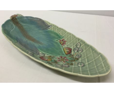 A Clarice Cliff Newport Pottery elongated serving dish with leaf & fruit design. 32cm long