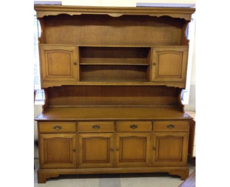 A large light wood dresser 176cm wide and 199cm tall