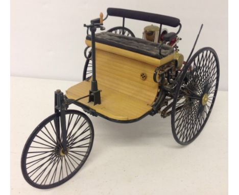 A large scale model of an early power driven trike/car. Approx 30cm long