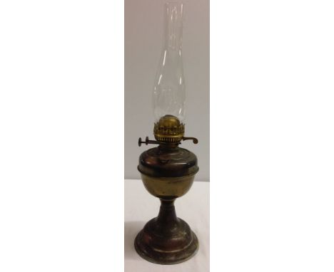 A vintage brass oil lamp.