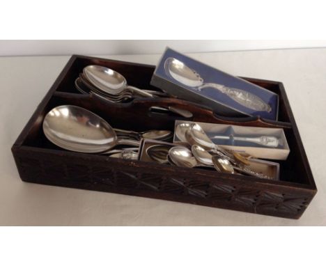 A vintage carved wood cutlery tray containing a large quantity of silver plated cutlery, together with 16 collectors spoons.