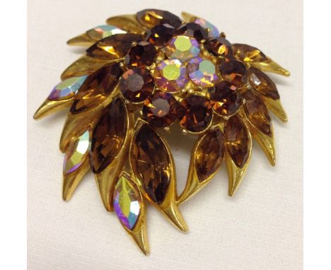 Attractive vintage brooch by Sphynx. Approx 2" x 2". Set with multi-coloured stones.