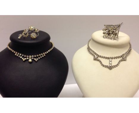 2 vintage diamante necklaces, one with aurora borealis stones, the other with white stones, both with matching brooches.