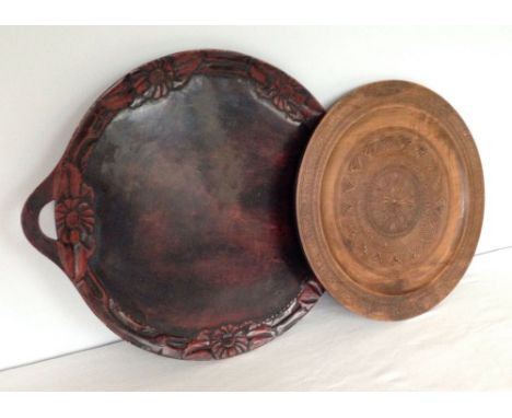 2 vintage carved wooden trays. One 39cm diameter, the other 44cm diameter.