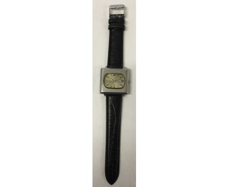 A vintage Seiko 5 square automatic wristwatch with 21 jewels, day & date window, black leather strap and stainless steel case