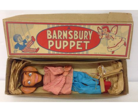 A boxed Barnsbury puppet chimpanzee.