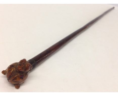 A vintage cane swagger stick with carved Boxer dog head finial.