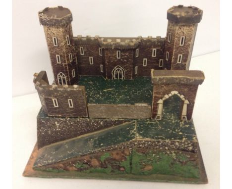 A vintage small wooden toy soldier fort/castle.