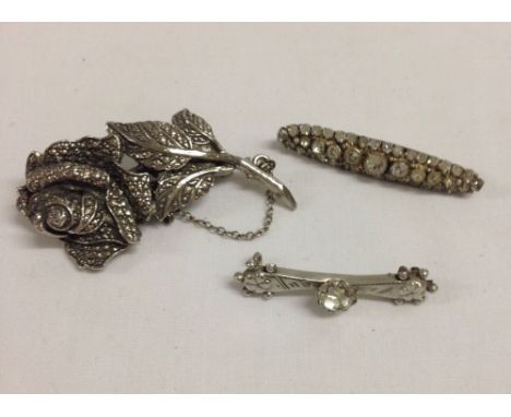 2 vintage silver bar brooches, one set with diamante, the other with a central white stone (pin missing).  Together with a ma