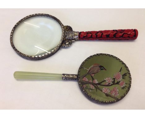 An oriental magnifying glass with cinnabar handle together with a vintage hand mirror with hand painted bird decoration and j