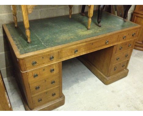 A vintage pedestal desk with green leather top. Comes in 3 parts being two 3 drawer pedestals and the top with drawers. 135cm