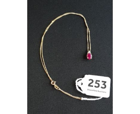 9 CARAT GOLD RUBY AND DIAMOND DROP ON 9 CARAT GOLD CHAIN