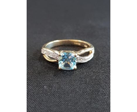 9 CARAT GOLD DIAMOND AND BLUE TOPAZ RING