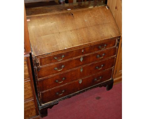 A George III walnut slope front four drawer writing bureau raised on bracket supports (with damages) width 93cm
