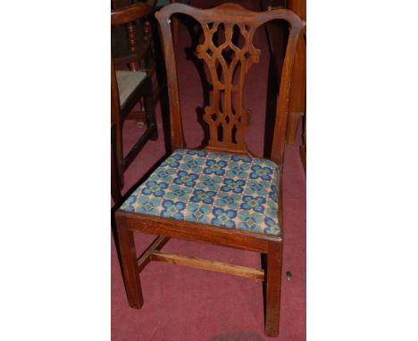 A collection of four 19th century mahogany Chippendale style dining chairs, each with floral tapestry upholstered drop-in pad