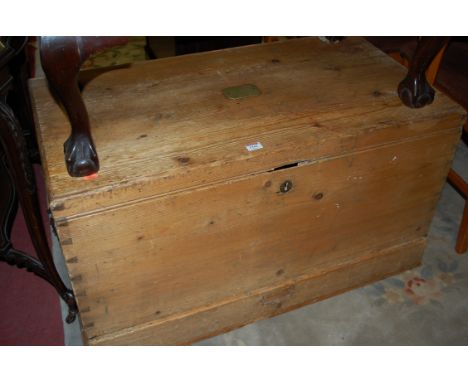A Victorian pine hinged top travelling trunk, having single lower drawer with applied brass plaque engraved 'JWC Butcher, Off