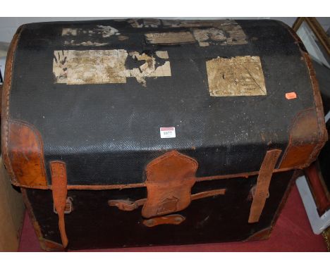 A leather capped dome-top trunk and an old leather suitcase (2) 
