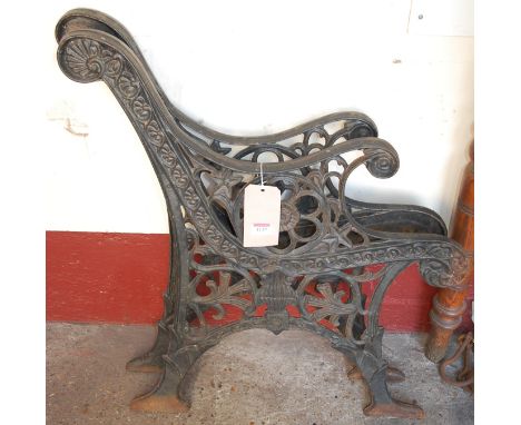 A pair of black painted wrought iron bench ends, only