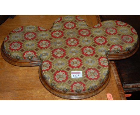 A Victorian walnut floral tapestry upholstered and brass studded low shaped kneeling stool