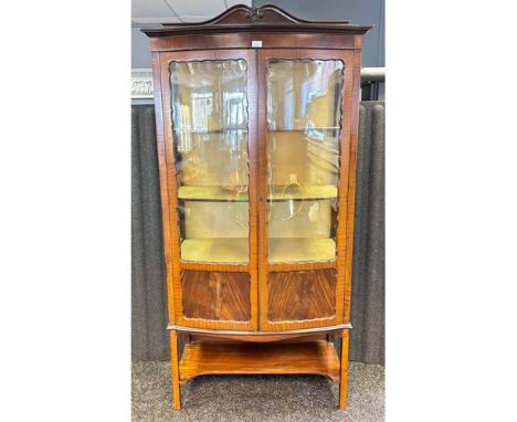 Reproduction display cabinet, the shaped top rail above gazed doors opening to shelved interior, with lower supporting shelf 
