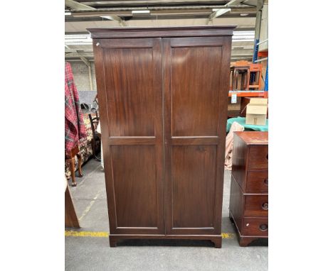 19th century mahogany double robe raised on bracket feet 