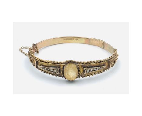 9ct Gold Edwardian ladies bangle with large yellow opal centre stone marked Birmingham with granulation and wire work detail 