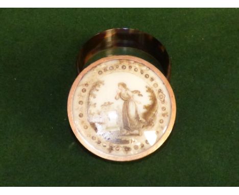 Georgian circular tortoiseshell and gold mounted snuff box, the lid with a classical lady in a garden setting