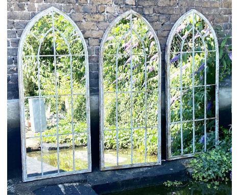 ARCHITECTURAL WALL MIRRORS, 160cm high, 67cm wide, set of three, Gothic style arched design aged painted, metal frames. (3) 