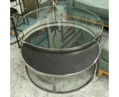 EICHHOLTZ LOW TABLES, a nesting graduated pair, one with a wood top, the other glass, polished metal supports, 120cm x 35c m 