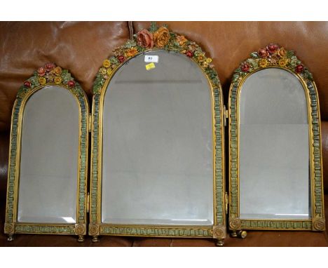 A mid Century gold-painted triptych dressing table mirror, with barbola mounts, 81 x 55cms.