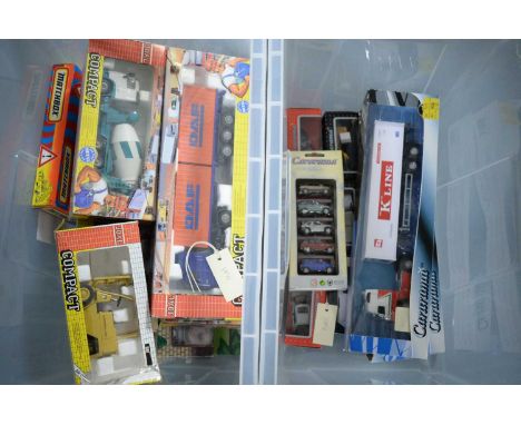 A collection of Joal Compact diecast models, including Caterpillar elevator truck series V; DAF 95 XF container truck; and ot