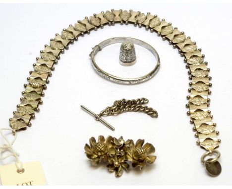 A silver floral brooch; a silver bangle; a part of a silver albert chain; a white metal fancy chain, unmarked; and a metal th