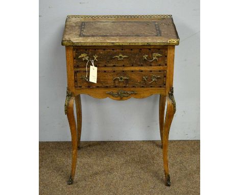 A Louis XVI style Inlaid rosewood and gilt metal night table, the top with three quarter brass gallery, above two banded draw