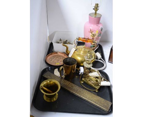 A selection of brass wares, including: pestle and mortar; tea kettle; tankard; and a table lamp with stylised floral and dog 