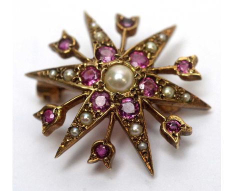 A pink sapphire and seed pearl brooch, of star design in 9ct yellow gold mount, 3.5g gross. 