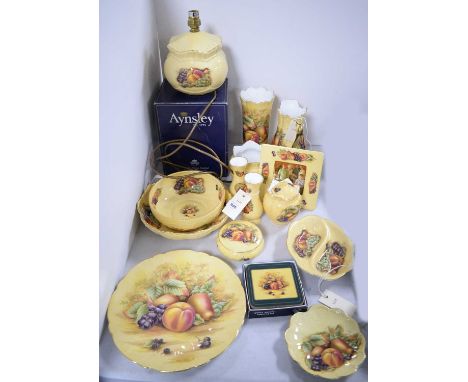 A collection of Aynsley ‘Orchard Gold’ ceramics, including: table lamp; vase; jars with covers; coasters; photograph frame; a