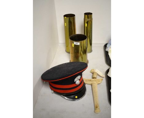Three brass shell case vases, of sizes; together with a cap by J. Compton Sons &amp; Webb Ltd London; and a Kris with carved 