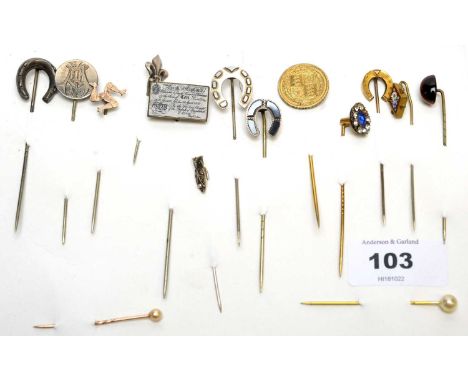 A collection of tie pins, including on enamel and metal with 'Ten Pound' note design, one tiger's eye, one with micromosaic f