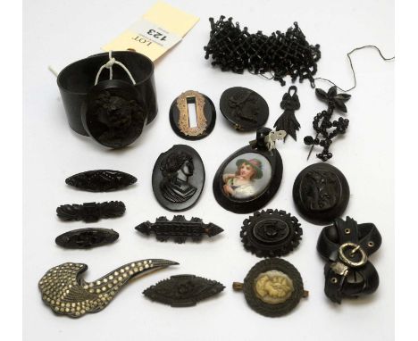 A selection of jet jewellery, including a bangle, buckle pattern brooch; other brooches, pendant and items.