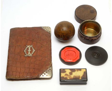 A lithograph covered tin football inscribed 'Match'; a plated metal collapsing cup, in case; an ebony seal case holding a wax