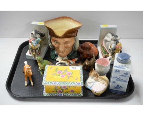 A selection of decorative ceramics, including: Royal Doulton ‘Vicar of Bray’ Toby jug; Beswick hunting figure of a fox; Beswi