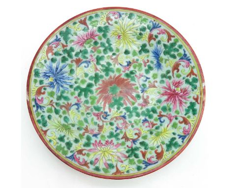 Light green background with floral decor, 33 cm. in diameter.