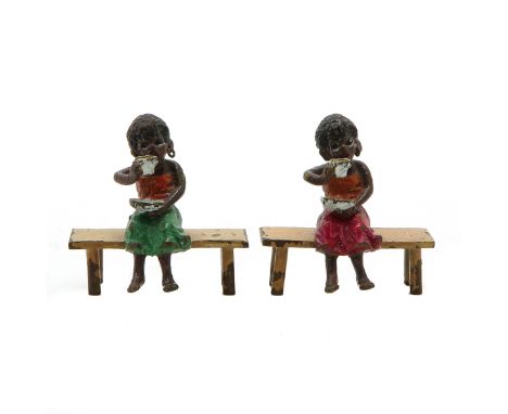 Depicting girls sitting on bench, 4 cm. tall.