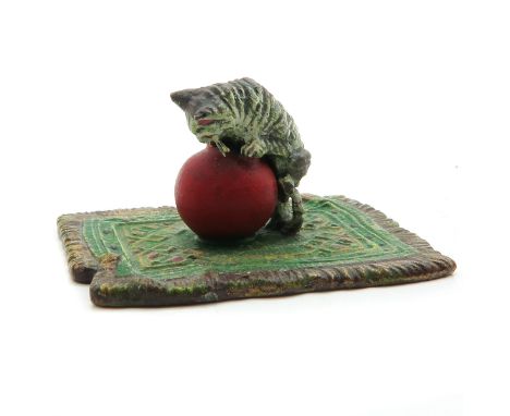 Depicting cat playing with ball, 6 cm. long.