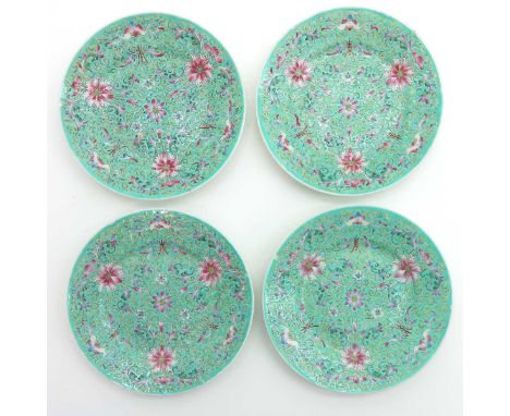 Light green background with famille rose enamels, marked with 4 characters on the bottom, 20 cm. in diameter, including chip.